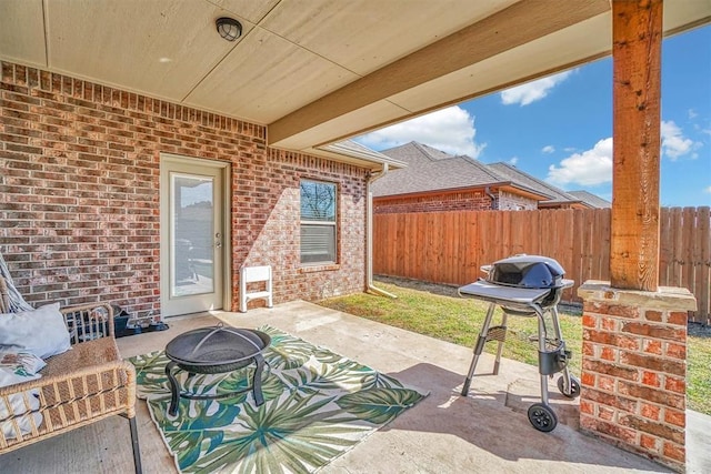 view of patio / terrace with an outdoor fire pit