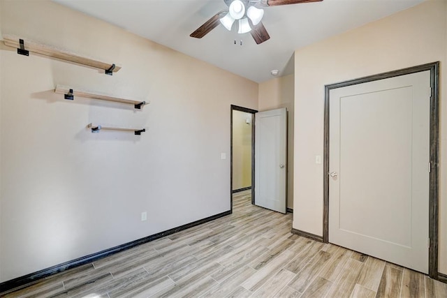 unfurnished bedroom with light wood-type flooring and ceiling fan