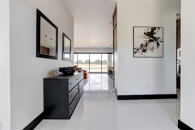 hallway featuring light tile patterned floors