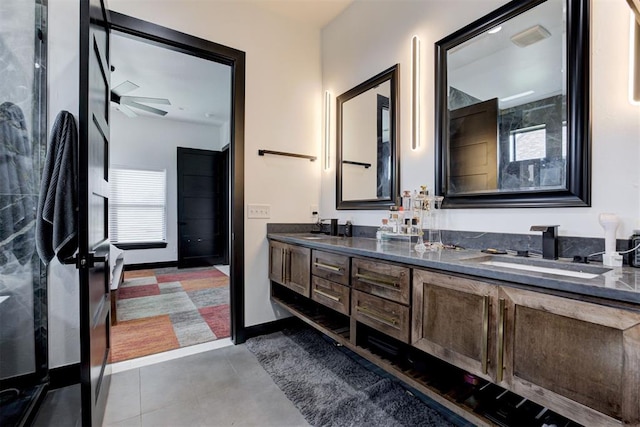 bathroom featuring tile patterned floors, ceiling fan, and vanity