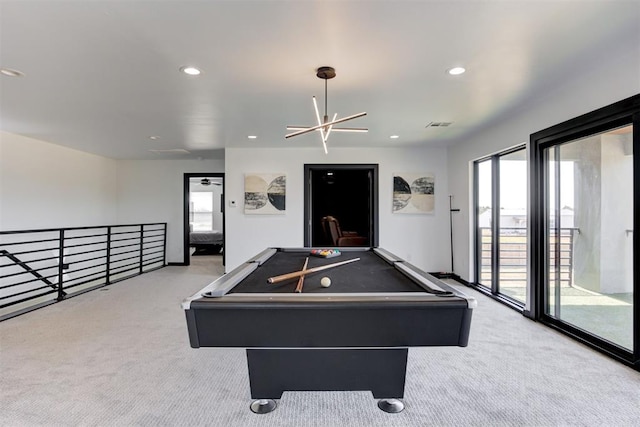 recreation room with light carpet, an inviting chandelier, and pool table