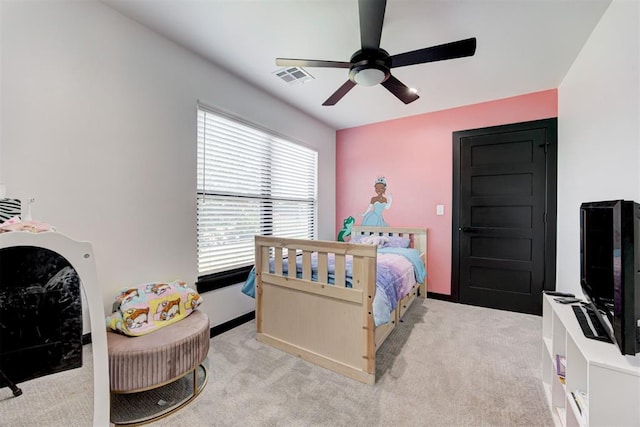 bedroom featuring light carpet and ceiling fan