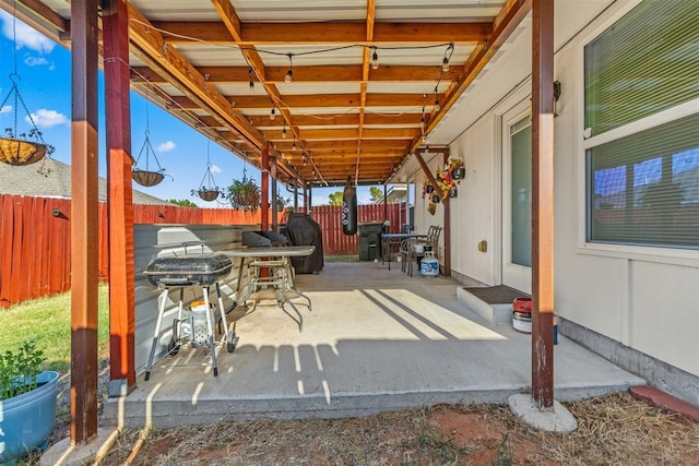 view of patio featuring fence