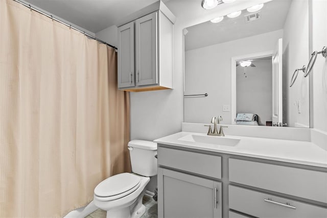 ensuite bathroom with toilet, visible vents, connected bathroom, and vanity