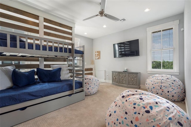 carpeted bedroom with ceiling fan