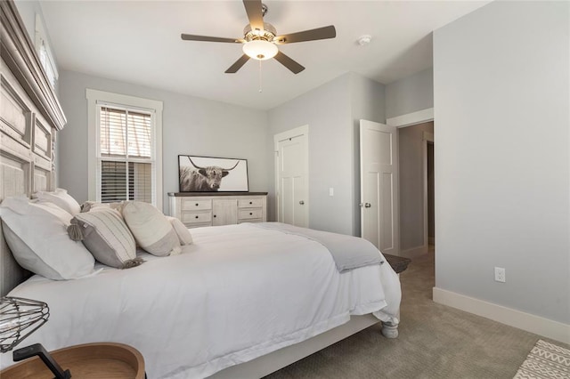 carpeted bedroom with ceiling fan