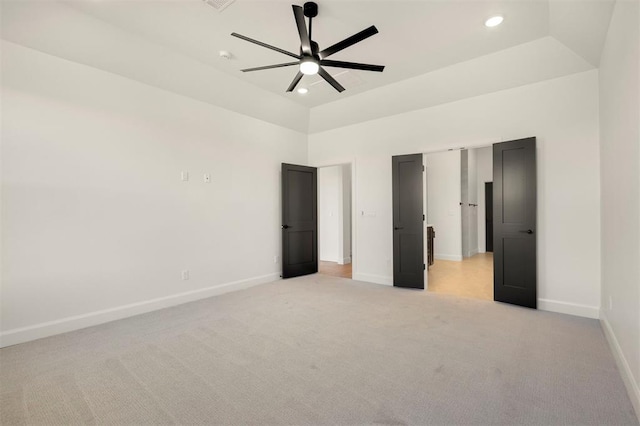 unfurnished bedroom with a ceiling fan, recessed lighting, baseboards, and light carpet