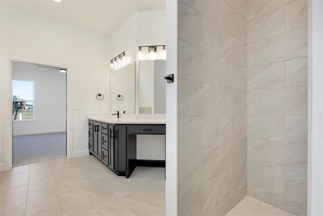 bathroom with vanity and baseboards