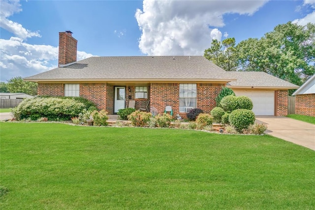 ranch-style home featuring a front yard and a garage