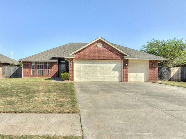 ranch-style house with a front yard and a garage