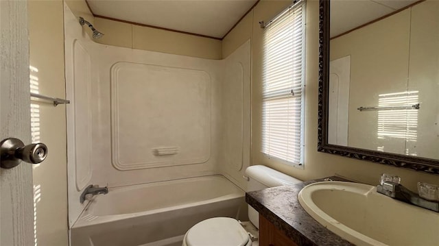 full bathroom featuring toilet, vanity, and bathing tub / shower combination