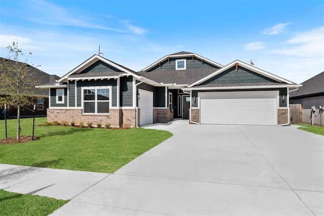 craftsman-style home featuring a front yard and a garage