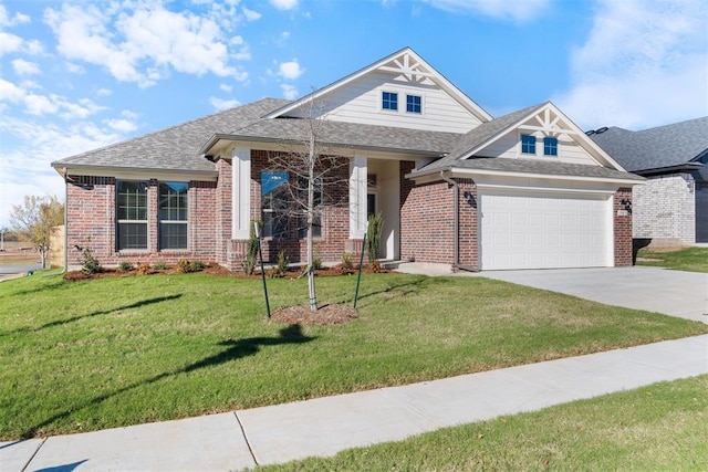 view of front facade with a front yard and a garage