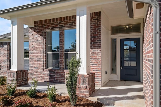 doorway to property with covered porch