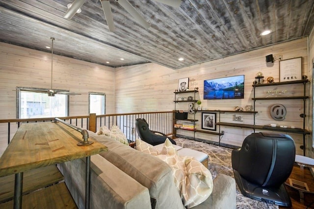 living room featuring wood walls, ceiling fan, wood ceiling, and wood-type flooring