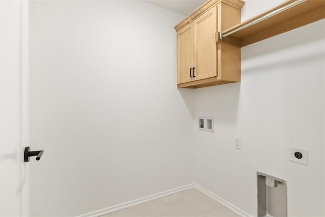 clothes washing area with hookup for an electric dryer, hookup for a washing machine, and cabinets