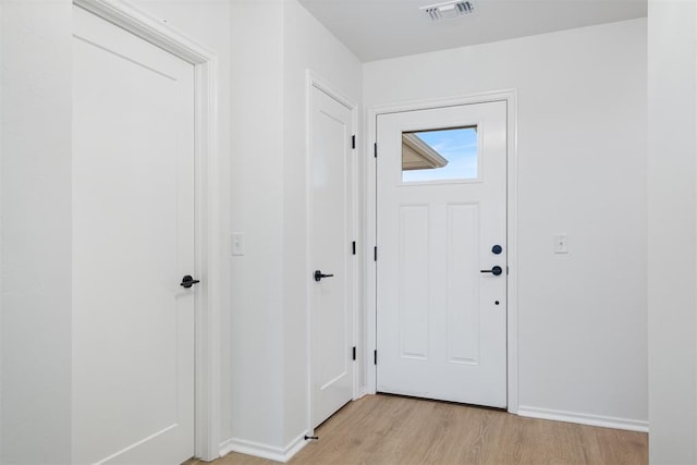 foyer entrance with light hardwood / wood-style floors