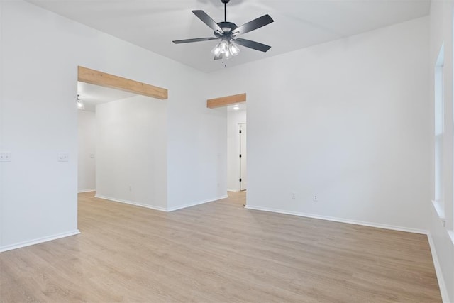 empty room featuring ceiling fan and light hardwood / wood-style floors