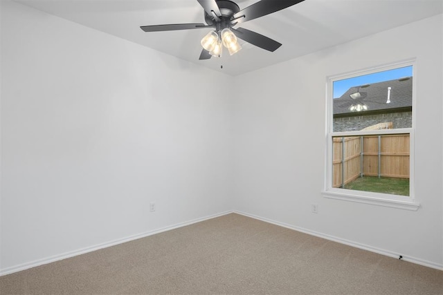 unfurnished room with carpet flooring, ceiling fan, and a healthy amount of sunlight