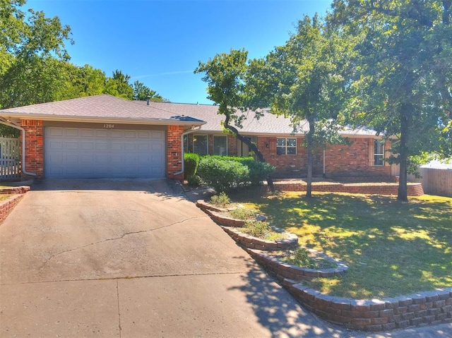 single story home with a garage and a front yard