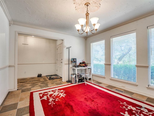 misc room featuring crown molding, a wealth of natural light, and a chandelier