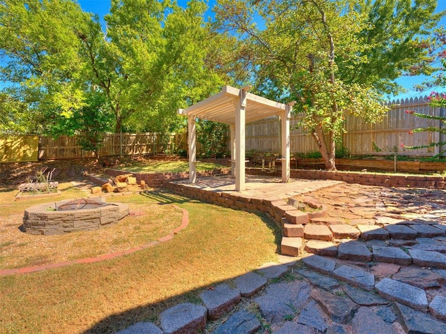 view of yard featuring a patio area and a fire pit