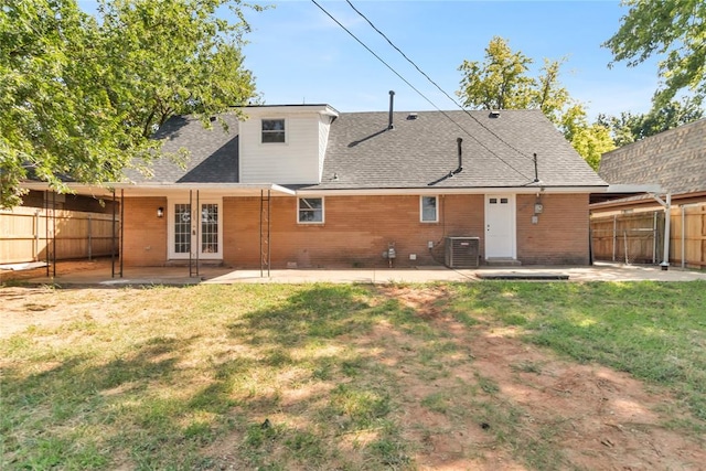 back of property featuring central AC, a yard, a patio, and french doors