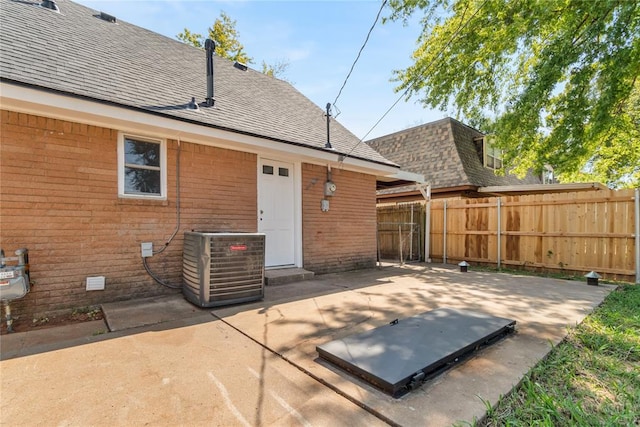 back of property featuring central AC unit