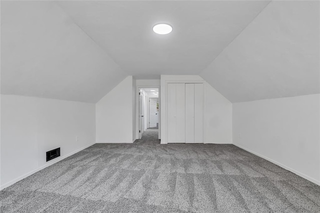 bonus room with carpet and lofted ceiling