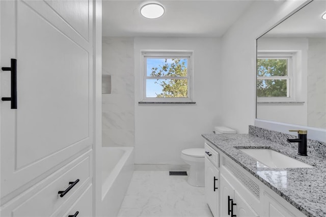 full bathroom featuring vanity, a healthy amount of sunlight, shower / bathing tub combination, and toilet