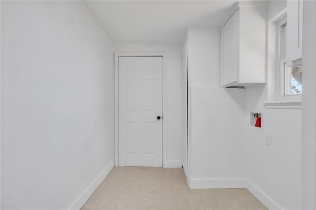 laundry room featuring cabinets and washer hookup