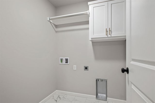 clothes washing area featuring cabinets, washer hookup, and hookup for an electric dryer