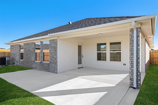 back of property featuring a patio area and central air condition unit