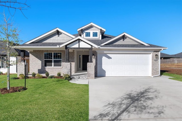 view of front facade with a garage and a front yard