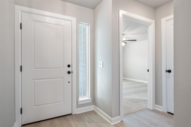 entrance foyer with light wood-type flooring and ceiling fan