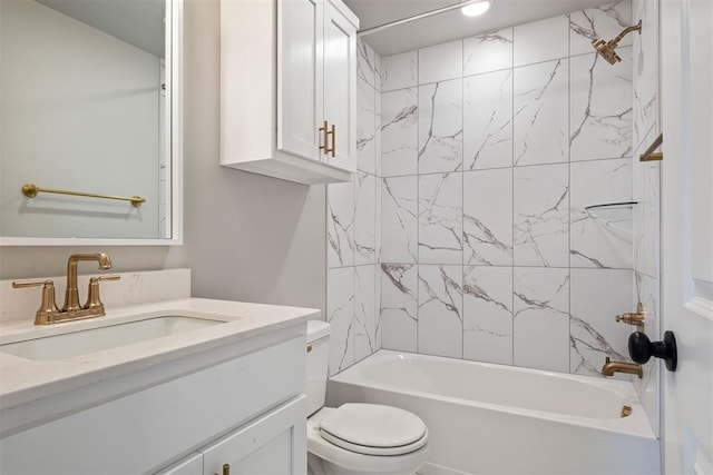 full bathroom featuring vanity, toilet, and tiled shower / bath