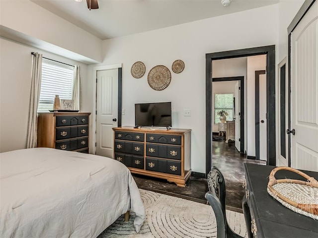 bedroom with ceiling fan and a closet