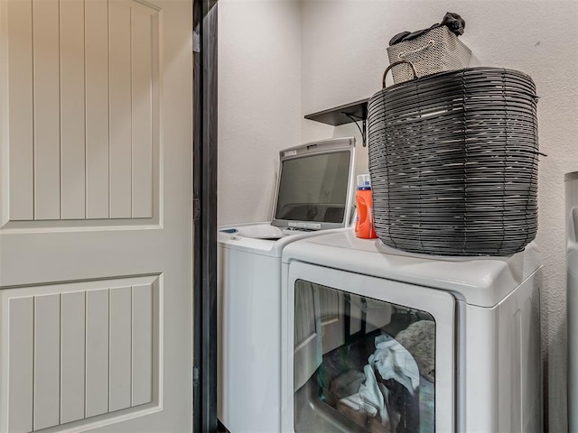 washroom with washer and clothes dryer