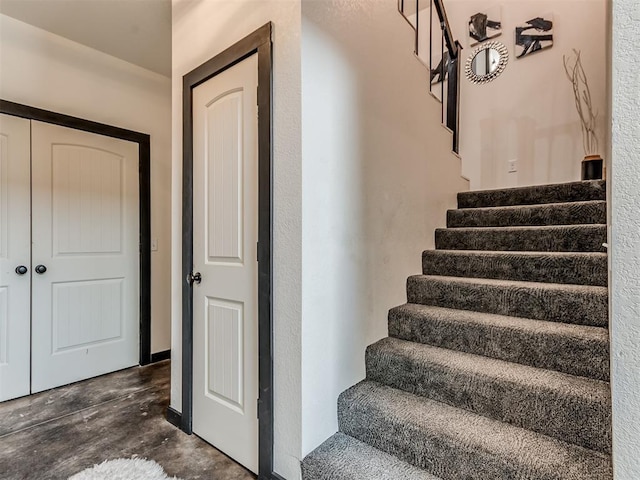 stairs featuring hardwood / wood-style flooring