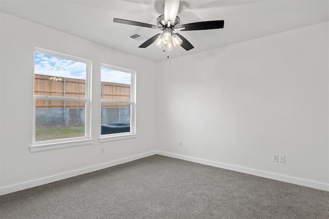 2144 Emily Rae Ln, Blanchard, OK 73010 - spare room featuring dark colored carpet and ceiling fan