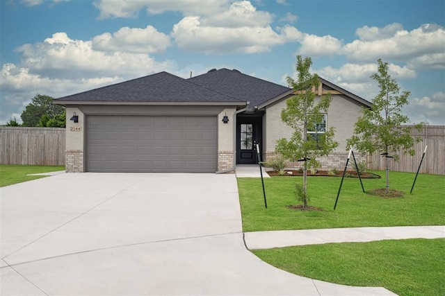 2144 Emily Rae Ln, Blanchard, OK 73010 - ranch-style house featuring brick siding, concrete driveway, an attached garage, and a shingled roof