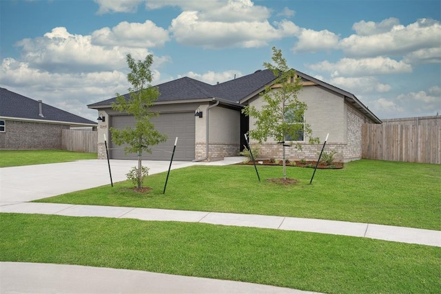 2144 Emily Rae Ln, Blanchard, OK 73010 - view of front of property featuring concrete driveway, brick siding, and a garage