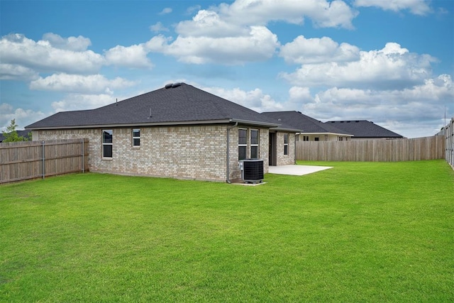 2144 Emily Rae Ln, Blanchard, OK 73010 - rear view of house with a patio area, a fenced backyard, brick siding, and roof with shingles