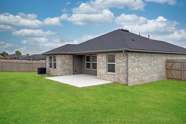2144 Emily Rae Ln, Blanchard, OK 73010 - rear view of house with a patio, a fenced backyard, a shingled roof, and brick siding