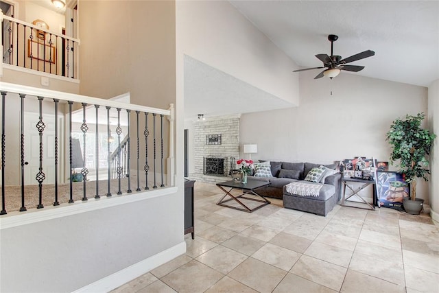 tiled living room featuring ceiling fan, high vaulted ceiling, and a brick fireplace