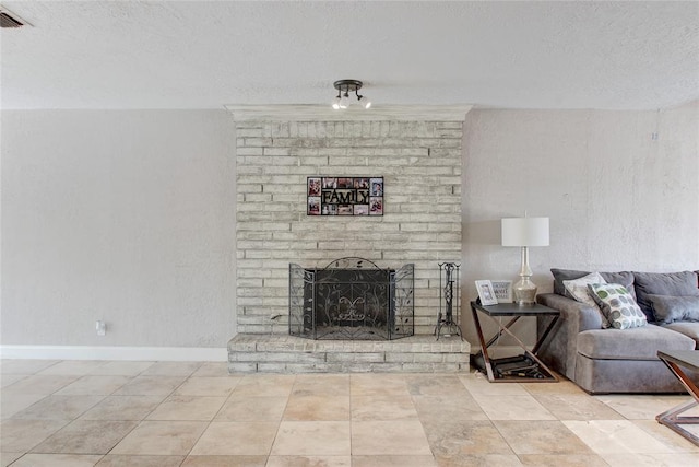 living room with a fireplace and a textured ceiling