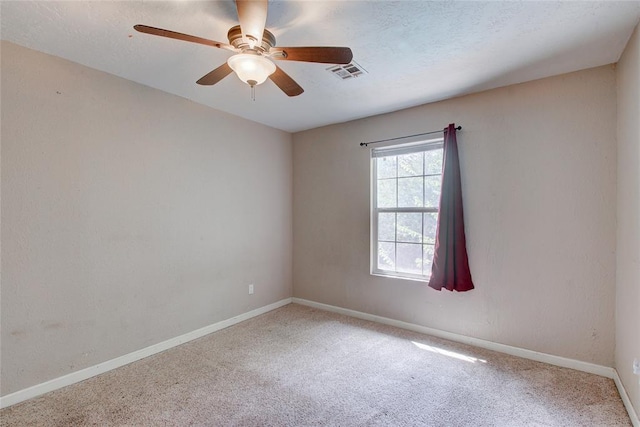 unfurnished room with carpet flooring and ceiling fan