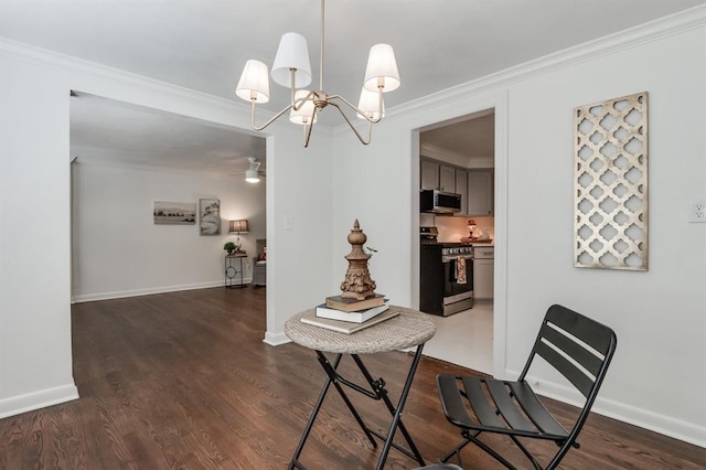 dining space with ceiling fan with notable chandelier, dark hardwood / wood-style floors, and crown molding