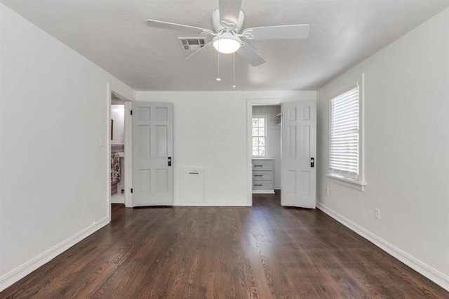 unfurnished bedroom with dark hardwood / wood-style floors and ceiling fan