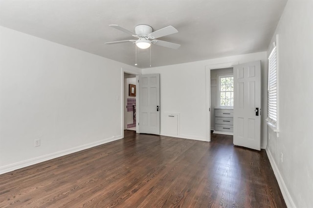 unfurnished bedroom featuring ceiling fan and dark wood-type flooring